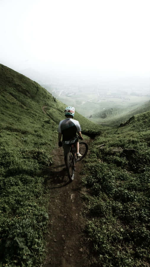 Hop On An Adventure With The Mountain Bike Iphone Wallpaper