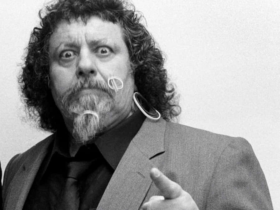Iconic Wrestling Personality Pointing Wallpaper