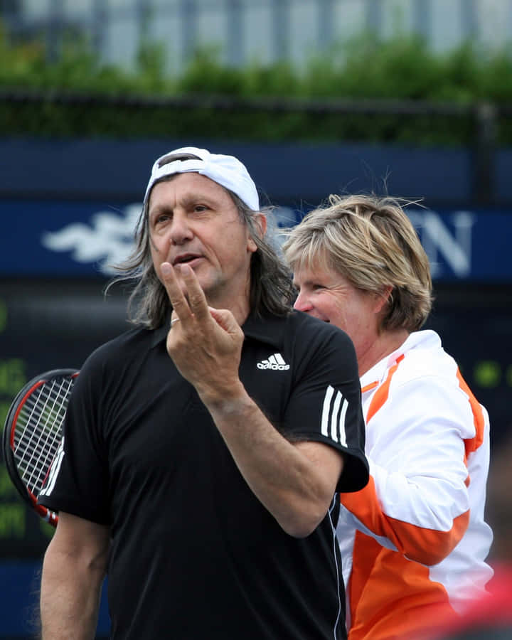 Ilie Năstase In Action During Us Open Exhibition Game Wallpaper