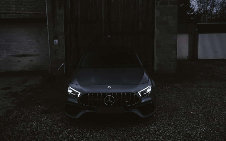 Image A Sleek And Sophisticated Black Mercedes Car Shining In The Sun Wallpaper