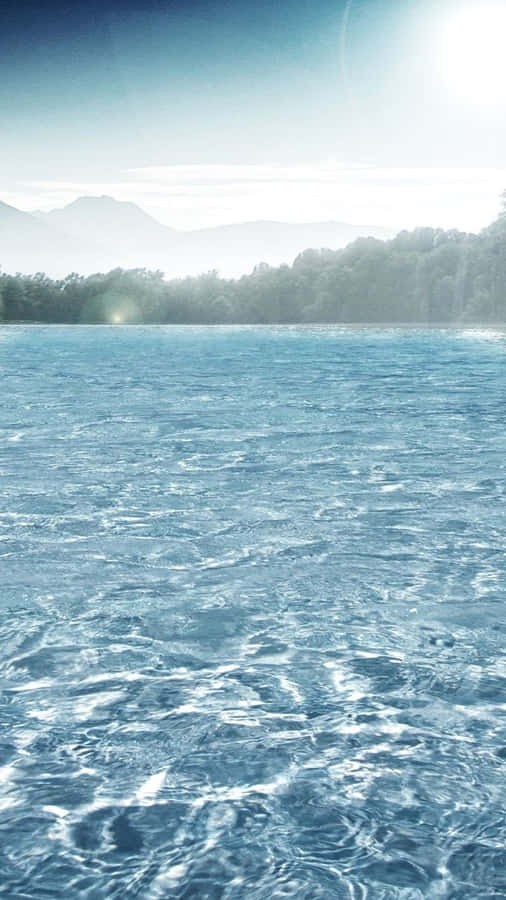Immerse Yourself In The Perfect Blend Of Nature And Technology With This Water Iphone Wallpaper. Wallpaper