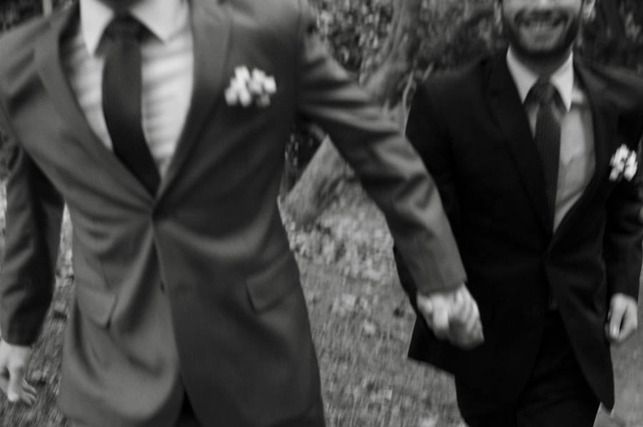 Intimate Moment Of A Joyous Gay Wedding In Blac & White Wallpaper