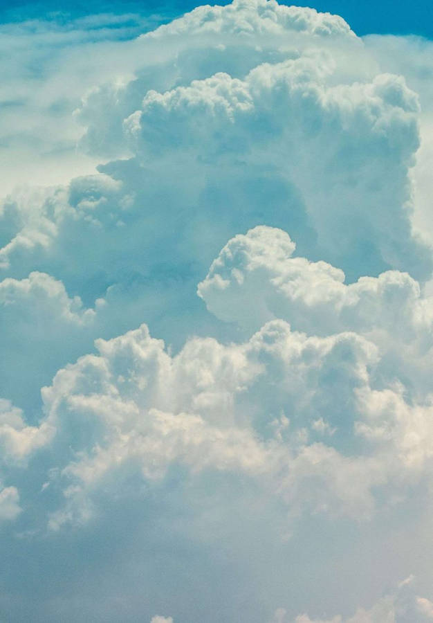 Ipad 2021 Accentuated Against Serene Cloudy Sky Wallpaper