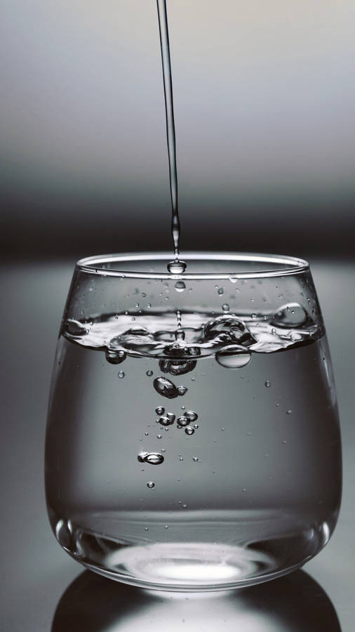 Iphone 12 Pro Max Pouring Glass Wallpaper