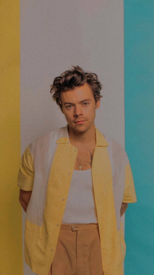 Iphone Harry Styles In A Yellow Polo Wallpaper
