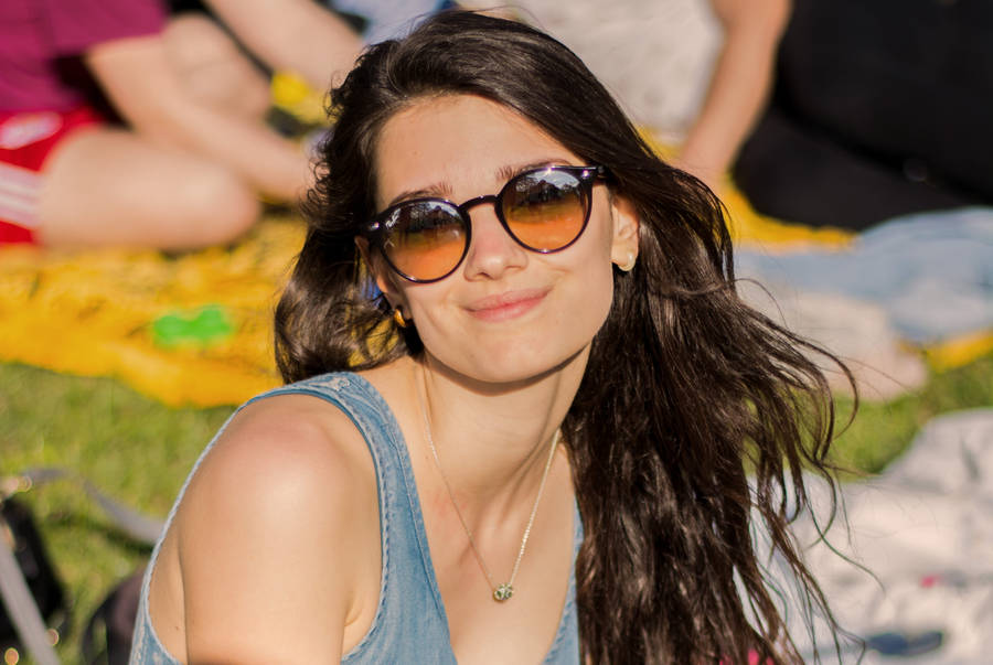 Italian Girl Wearing Sunglasses Outdoors Wallpaper