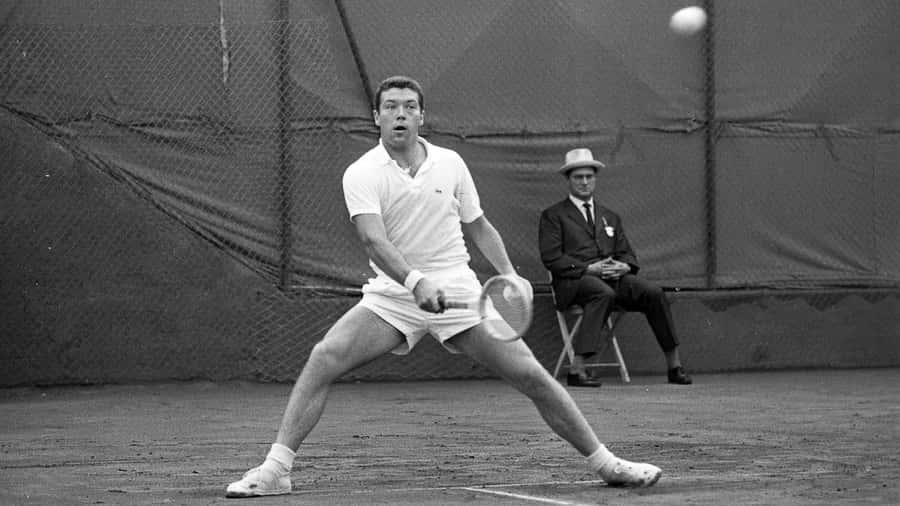 Italian Tennis Player Nicola Pietrangeli On Tennis Court Wallpaper