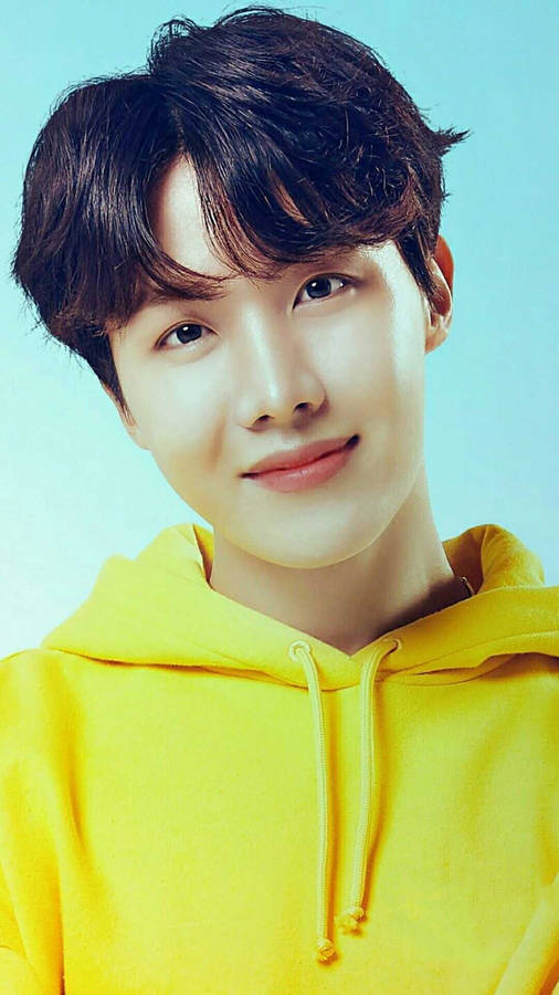J-hope Donning A Yellow Hoodie Wallpaper