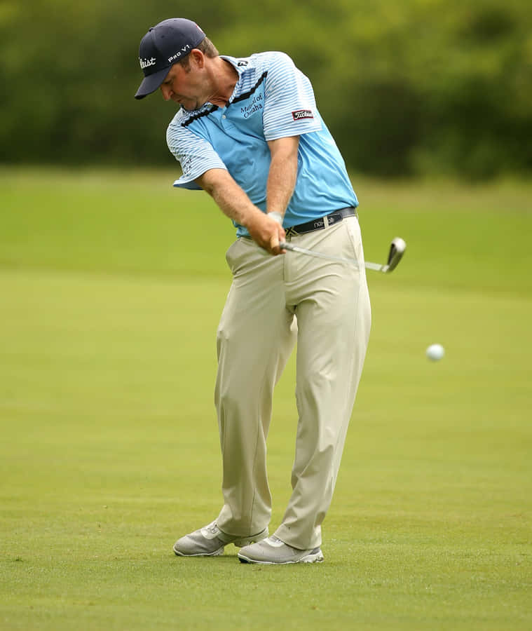 Jason Bohn Showcasing Perfect Golf Swing Posture Wallpaper