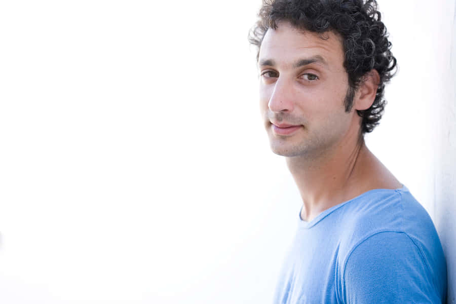 Jérôme Dreyfuss Leaning On White Wall Wallpaper