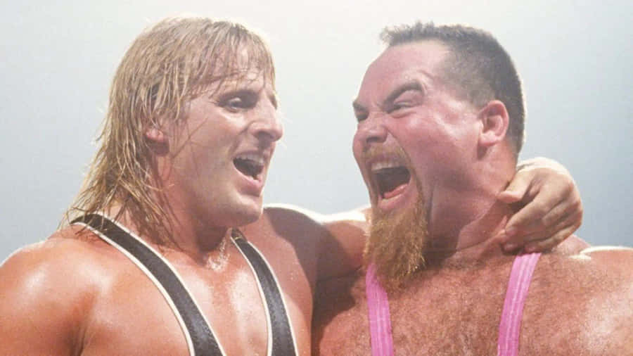 Jim Neidhart Laughing With Owen Hart Wallpaper