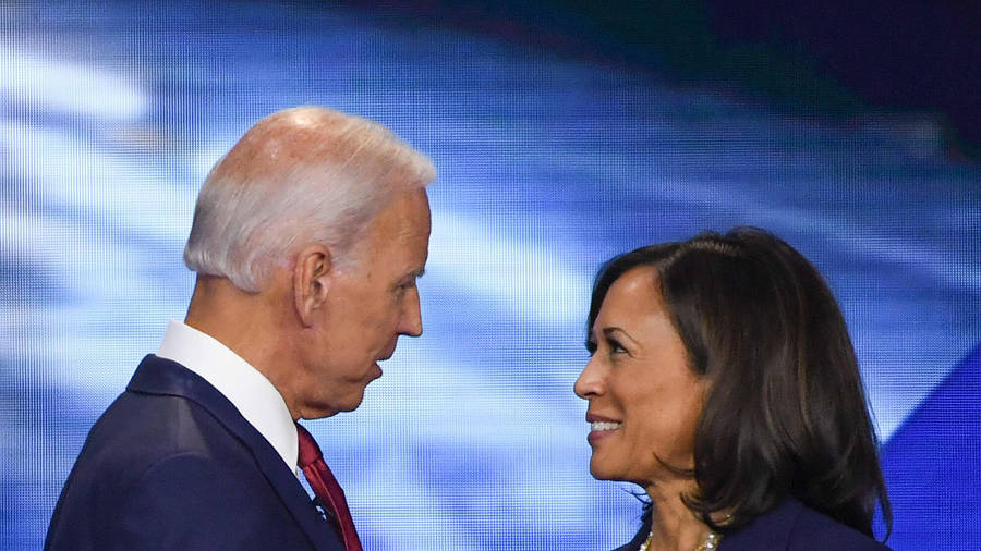 Joe Biden And Kamala Harris Embrace In Celebration Of The Us 2020 Elections Wallpaper