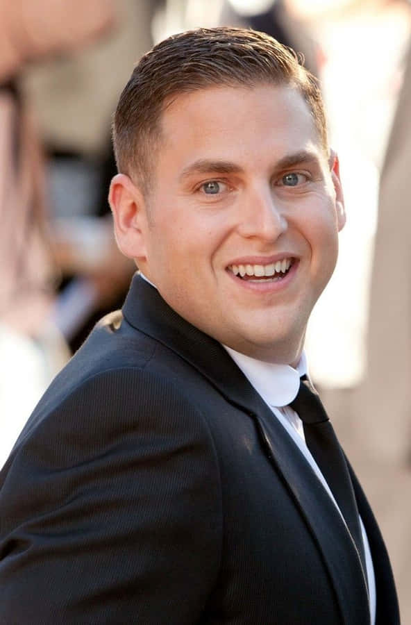 Jonah Hill Posing In A Slick Attire Wallpaper