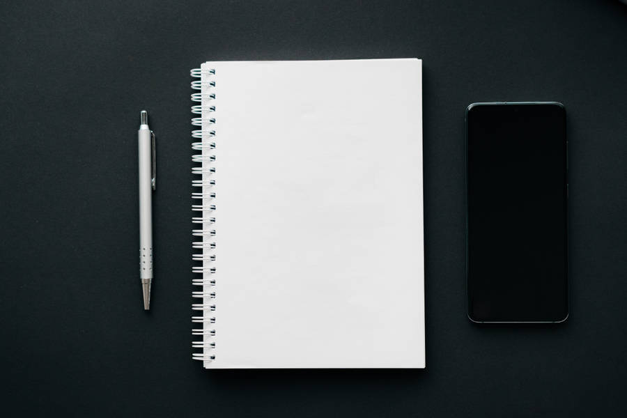 Journal And Black Cellphone Wallpaper