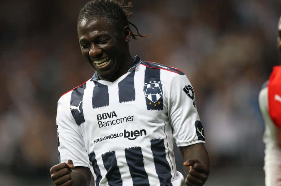 Joyful Soccer Player Celebration Wallpaper