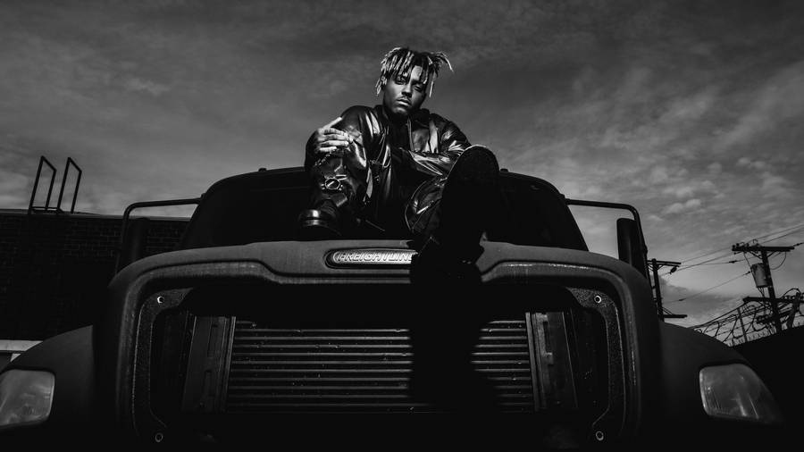 Juice Wrld In A Black And White Truck Wallpaper