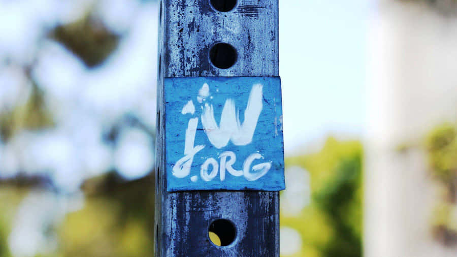 Jworg Logo Placed On Wooden Pole Wallpaper
