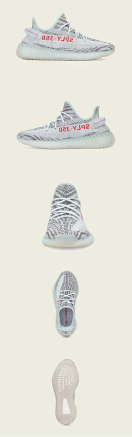 Kanye West Wearing His Famous Spread Collar Shirt And Yeezy Boost Sneakers Wallpaper