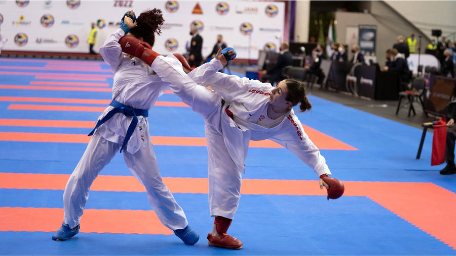 Karate Two Women Kick To Face Wallpaper