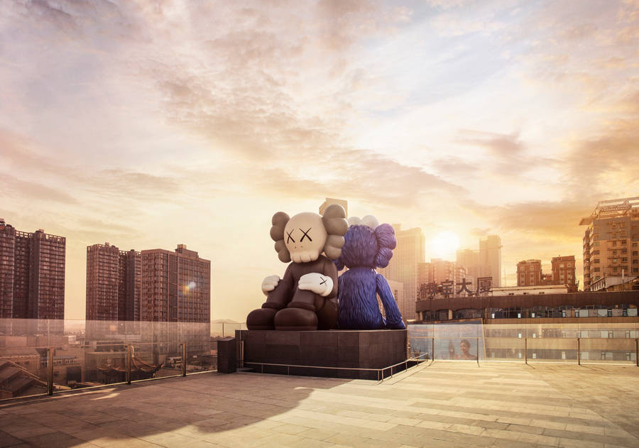 Kaws Sculpture Under Sunset Wallpaper