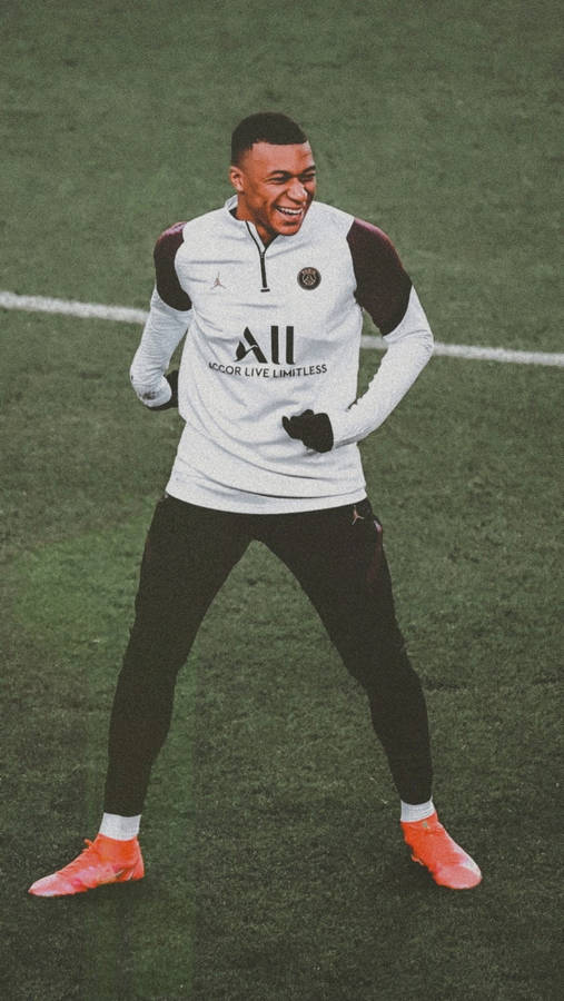 Kylian Mbappe Laughing At Field Wallpaper
