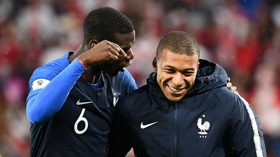 Kylian Mbappe Side-hugging Pogba Wallpaper