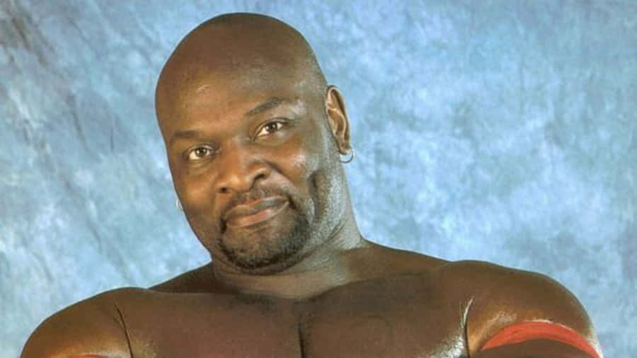 Legendary Ahmed Johnson In Wrestling Action Wallpaper