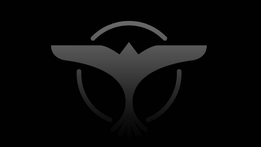 Legendary Dj Tiesto With His Signature Bird Emblem Wallpaper