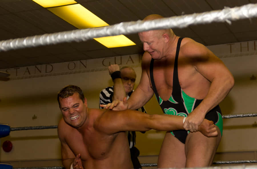 Legendary Irish Wrestler, Fit Finlay, Executing An Armbar Attack On Harry Smith. Wallpaper