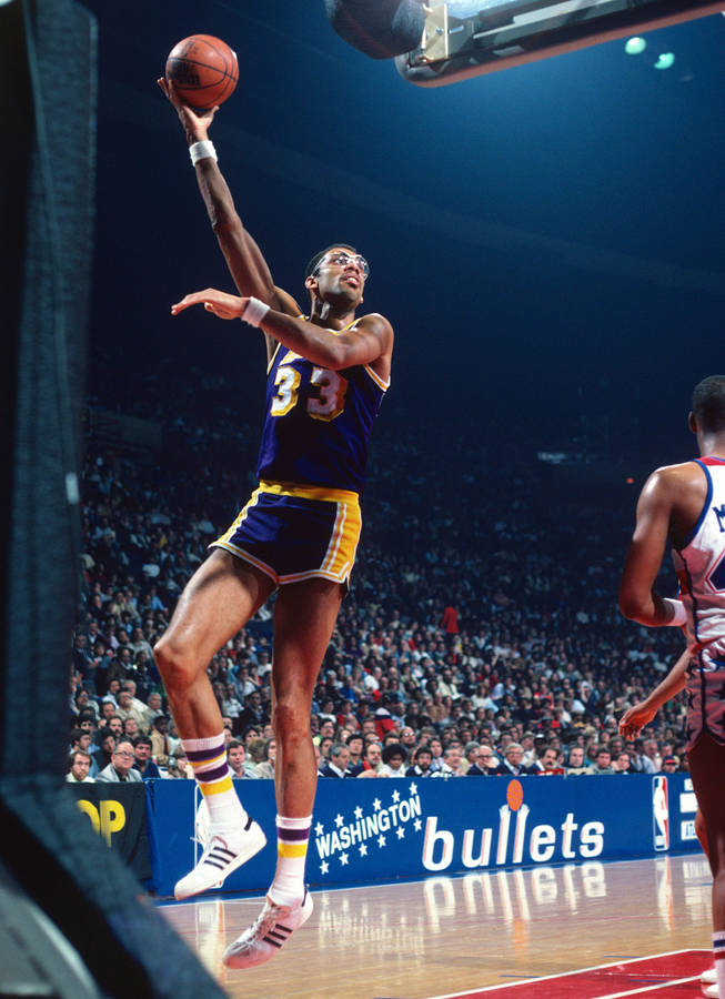 Legendary Kareem Abdul-jabbar Posing With Adidas Sneakers. Wallpaper