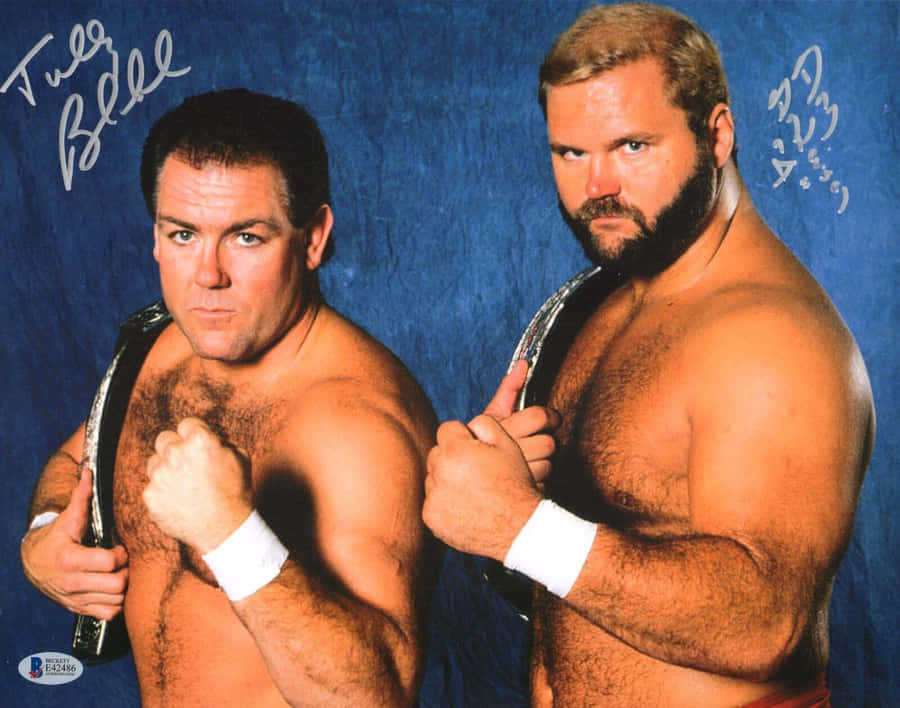 Legendary Wrestler, Arn Anderson, And Tully Blanchard Posing During An Autograph Signing Session. Wallpaper