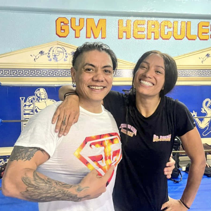 Legendary Wrestler Juventud Guerrera Posing With Wrestling Superstar Sasha Banks Wallpaper