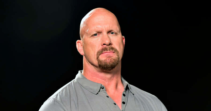 Legendary Wwe Star Steve Austin In The Ring Wallpaper