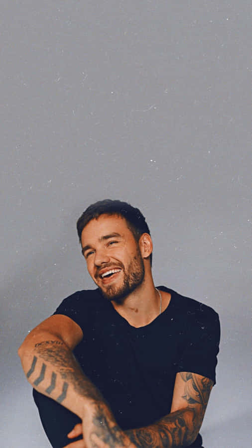 Liam Payne Having Fun On The Beach Wallpaper