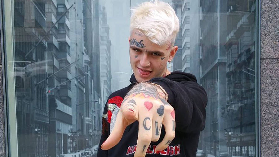 Lil Peep Gazing Off Into The Distance. Wallpaper