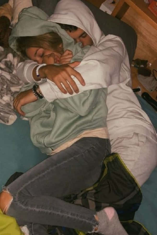 Loving Couple Enjoying A Romantic Moment Together Wallpaper