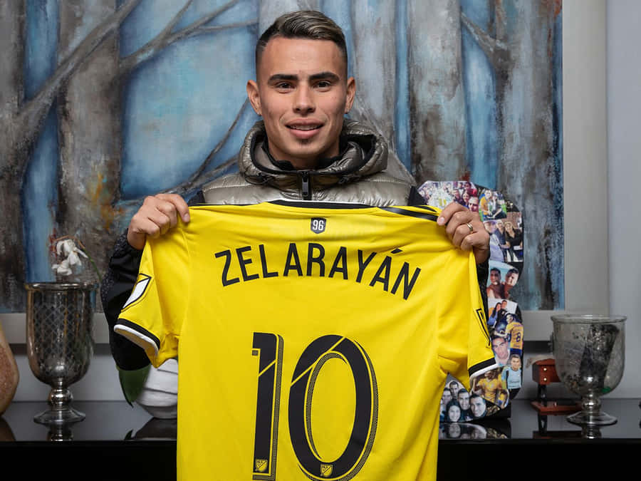 Lucas Zelarayan Holding His Columbus Crew Jersey Wallpaper