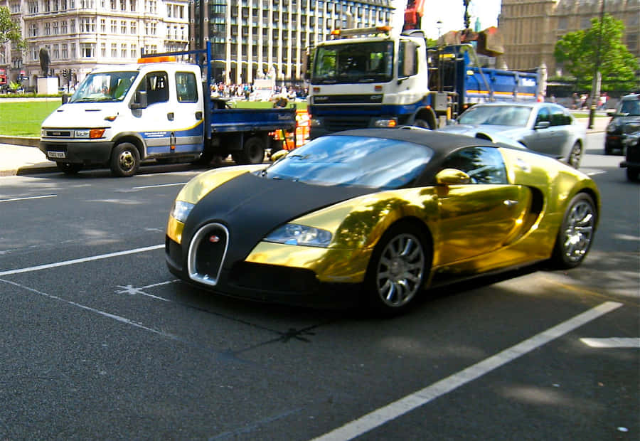 Luxury Meets Power With The Iconic Gold Bugatti Veyron Wallpaper