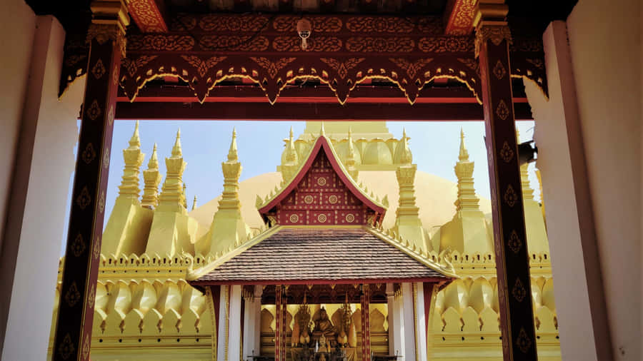 Magnificent Entrance Of Pha That Luang In Vientiane Wallpaper