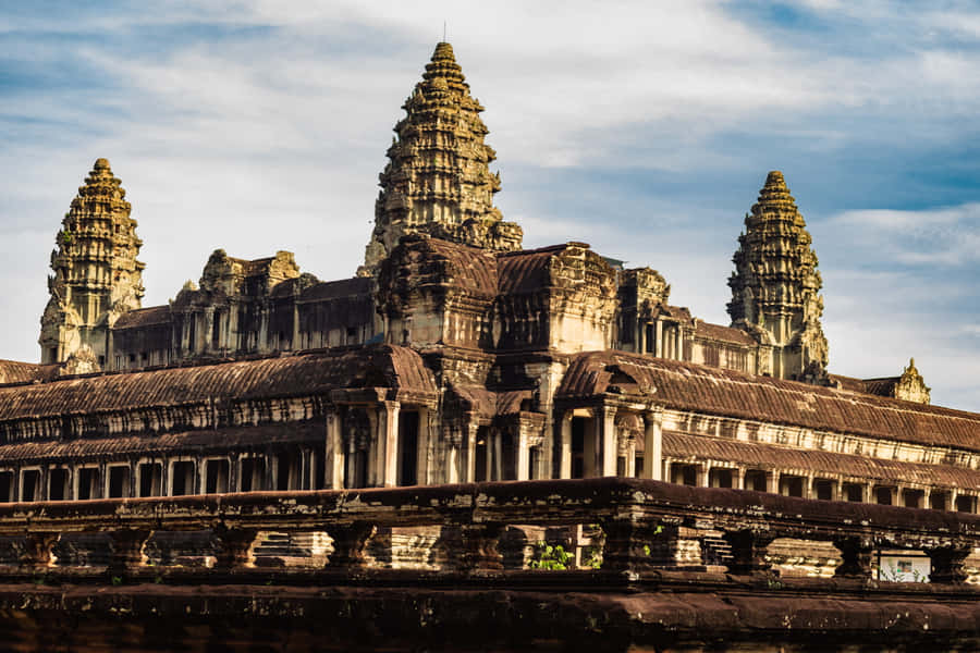 Majestic Angkor Thom Ruins In Stunning Brown Aesthetic Wallpaper