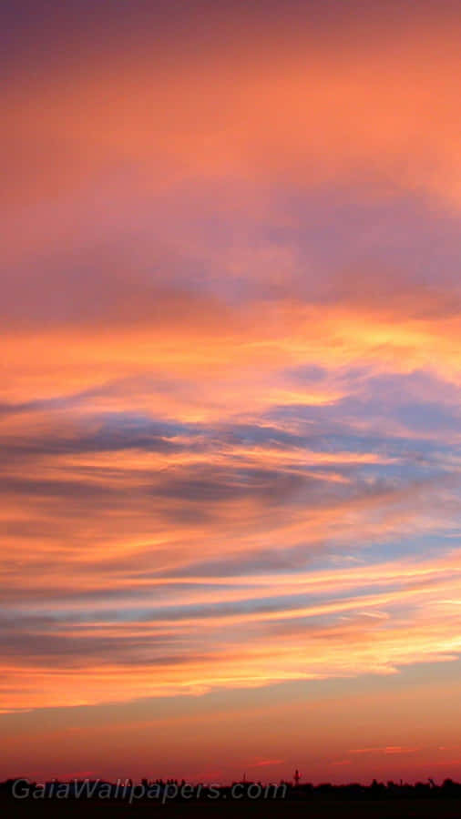 Majestic Clouds Against A Lavender Sky Wallpaper