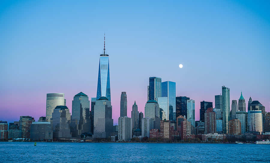 Majestic Freedom Tower Dominates The New York Skyline At Dusk Wallpaper