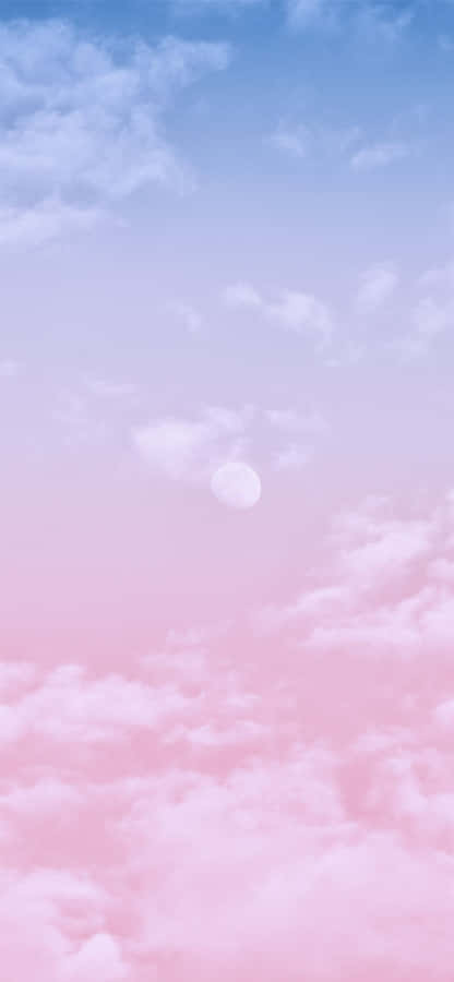 Majestic Pink And Blue Clouds As The Sun Sets Wallpaper