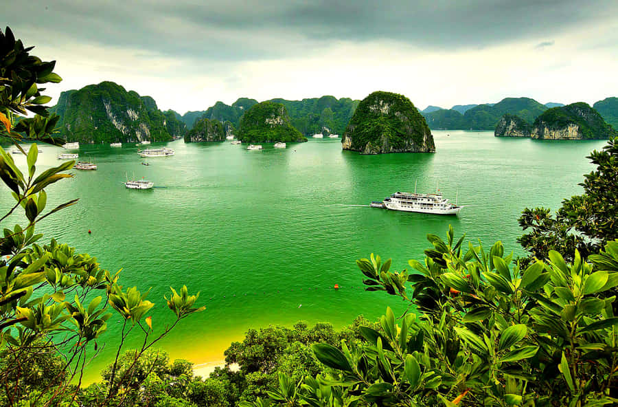Majestic View Of The Emerald Green Lagoon In Halong Bay Wallpaper