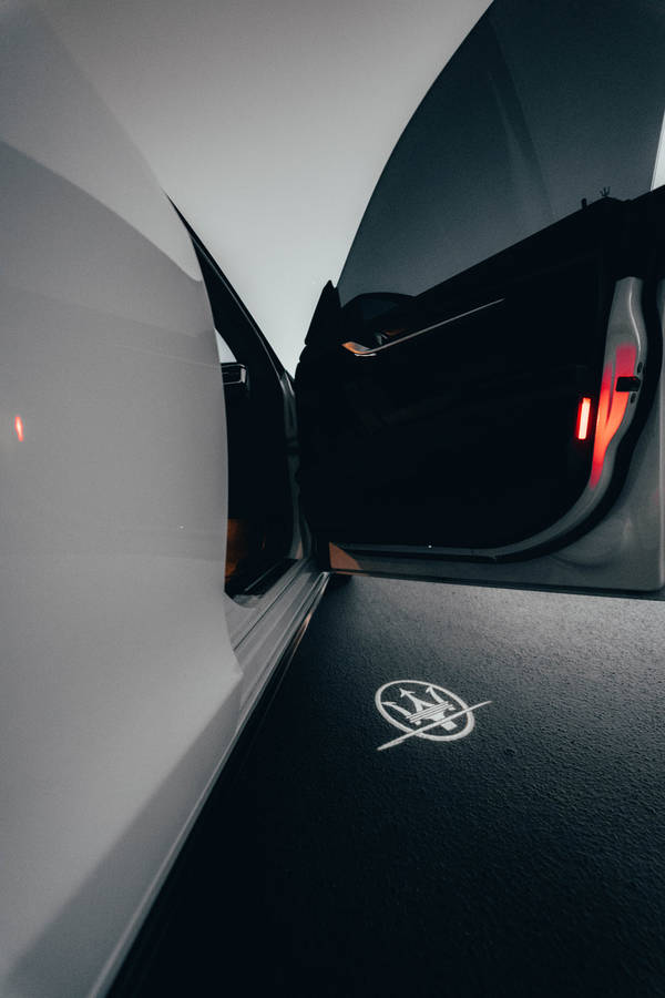 Maserati Logo Painted On Road Wallpaper