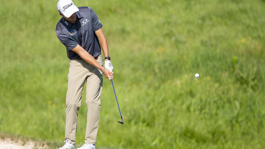 Michael Thompson Preparing For A Powerful Swing On The Golf Field Wallpaper