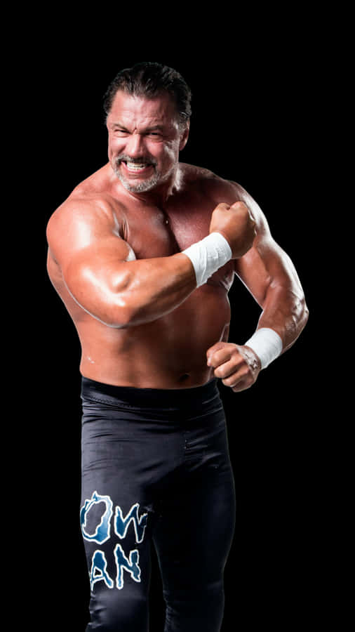 Muscular Wrestler Posing Aggressively.jpg Wallpaper