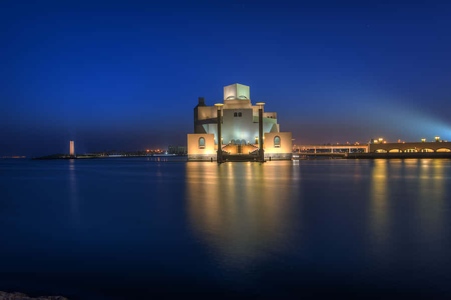 Museum Of Islamic Art Reflected In Evening Ocean Wallpaper