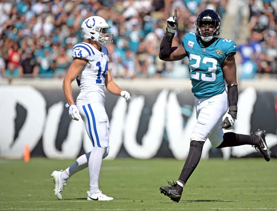 N F L Players On Field During Game Wallpaper