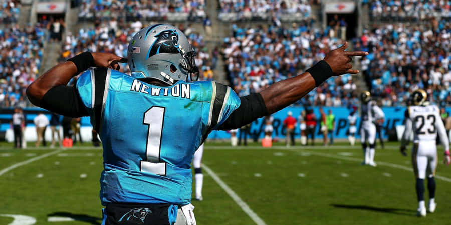 Nfl Star Cam Newton Throwing A Touchdown Wallpaper